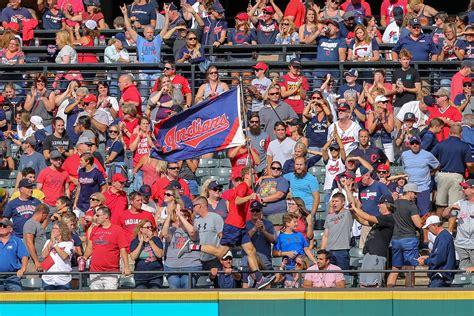 Fan using baseball diamond diagram to follow the game