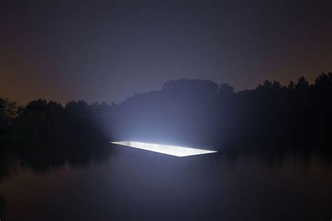 Recruits during a nighttime training exercise in a landscape environment