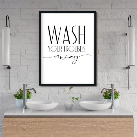 A decal with a quote applied to a bathroom wall