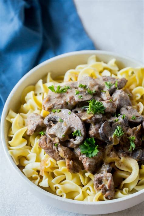 Beef stroganoff with egg noodles and steamed asparagus