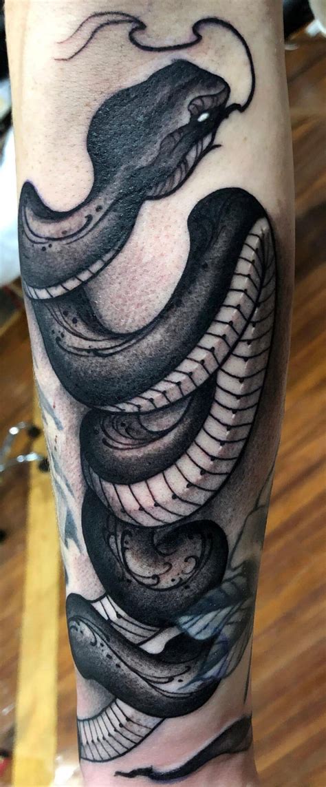 Black and gray snake tattoos for a classic look