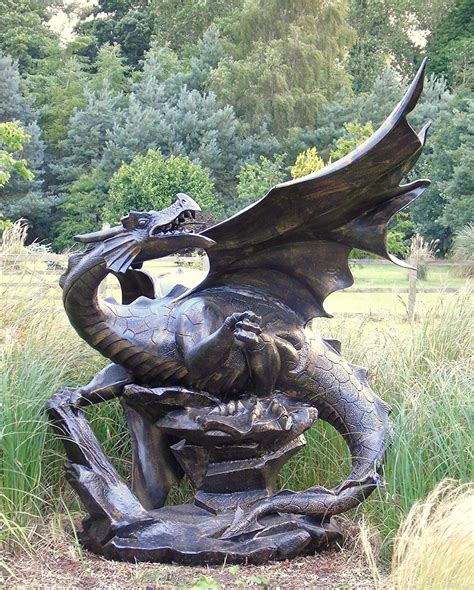 A breathtaking sculpture of a black dragon, with delicate, intricate details