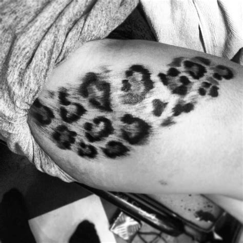 Black leopard print tattoos on different body parts