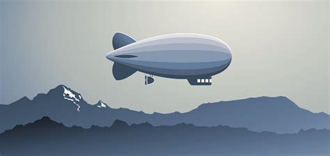 A blimp flying over a mountain