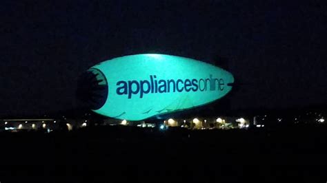 A blimp flying at night