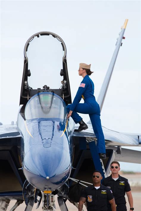 Blue Angels pilots standing in front of an F/A-18 Hornet