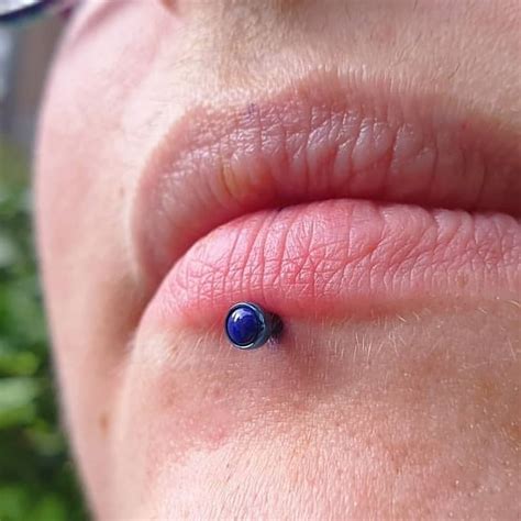 Blue body piercing maintenance