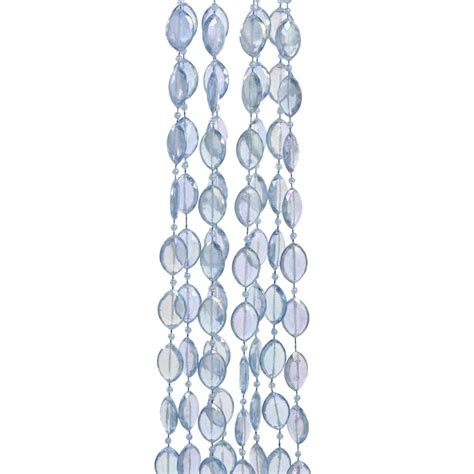 A blue Christmas tree decorated with a beaded garland and glass ball ornaments