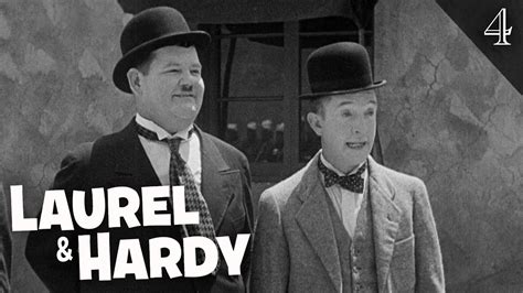 Bobby Vernon with Stan Laurel and Oliver Hardy on set