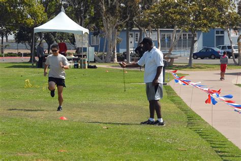 Boot camp participants running outdoors