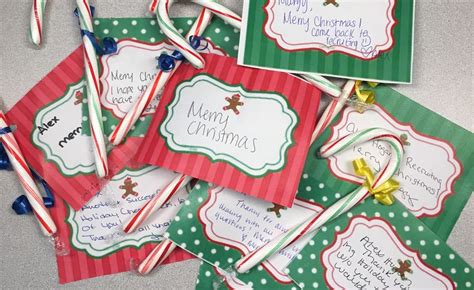 A photo of a Candy Cane Gram with a red background and a candy cane attached to it