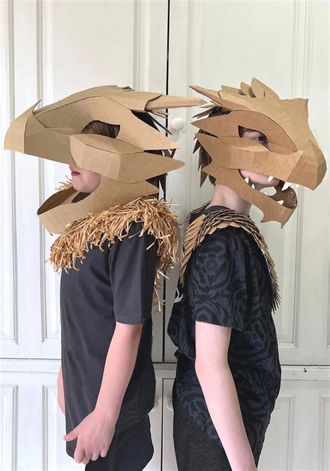 Cardboard dragon head template with a fantasy landscape