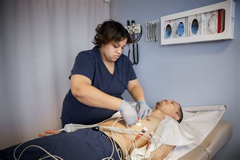 Cardiac technician assisting physician