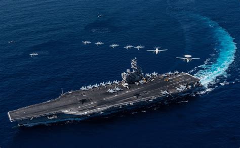 CVW-5 personnel conduct a foreign object damage walkdown on the flight deck of USS Ronald Reagan (CVN 76)