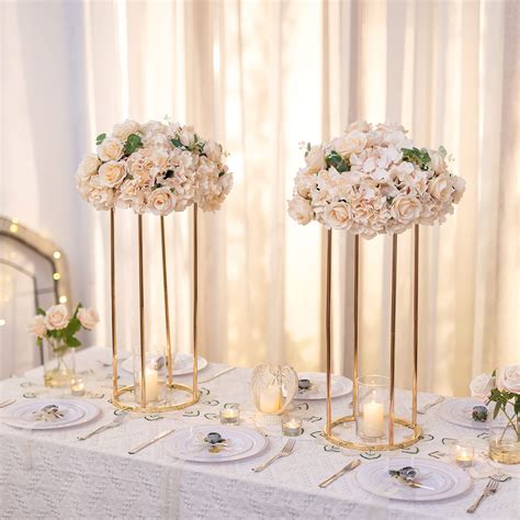 A stunning centerpiece adorned with a beautiful gold bow and lush greenery