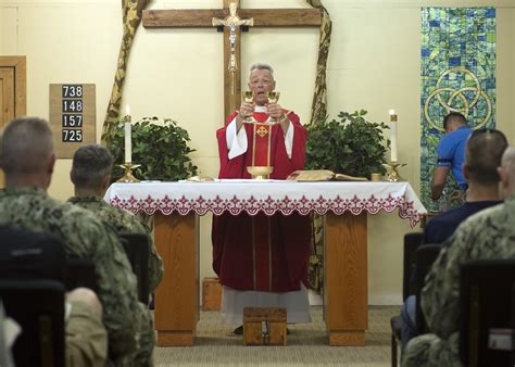 A military chaplain leading a ritual or ceremony