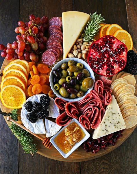 A charcuterie board with a variety of meats, cheeses, and crackers