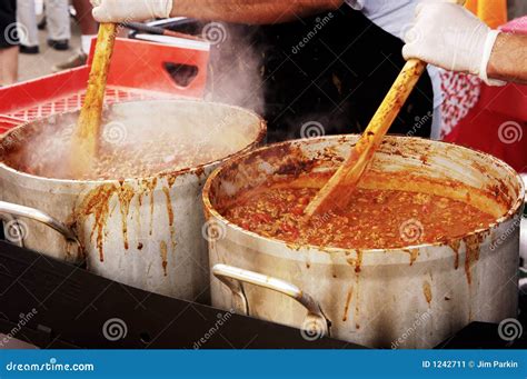 A bustling chili cook-off, with contestants and judges milling about