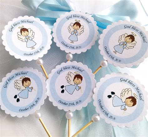 Christening cupcake toppers on a cupcake stand