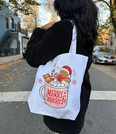 Christmas canvas bag with holly leaves and red ribbons