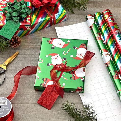 Christmas gift wrapping paper set with Santa and reindeer designs