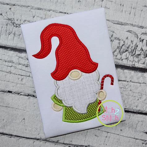 A Christmas gnome applique pattern on a sewing machine