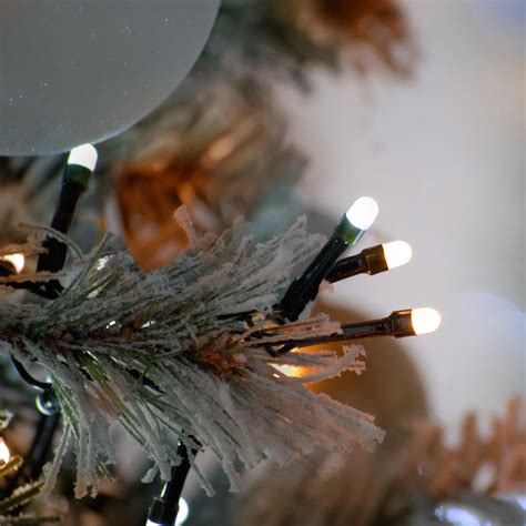 Christmas tree lights in a spiral pattern with garland