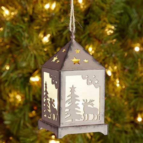 Metal lantern ornaments on a Christmas tree