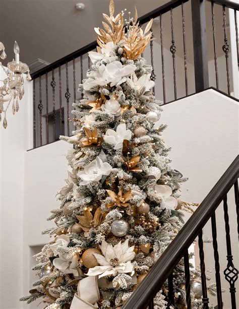 A classic white and gold Christmas tree