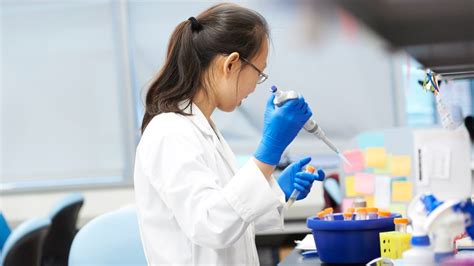 Clinical geneticist consulting with a patient