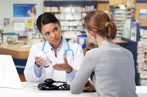 Pharmacy Technician assisting a patient