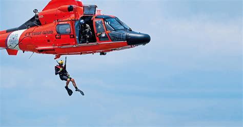 Coast Guard Operations Specialist communicating with team members