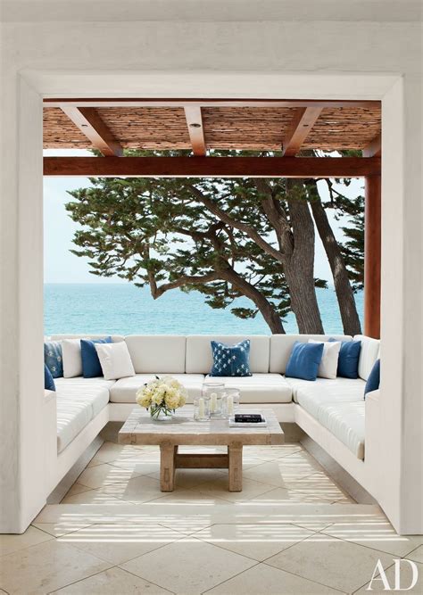 A coastal-inspired outdoor space featuring natural textiles and ocean-inspired accents.