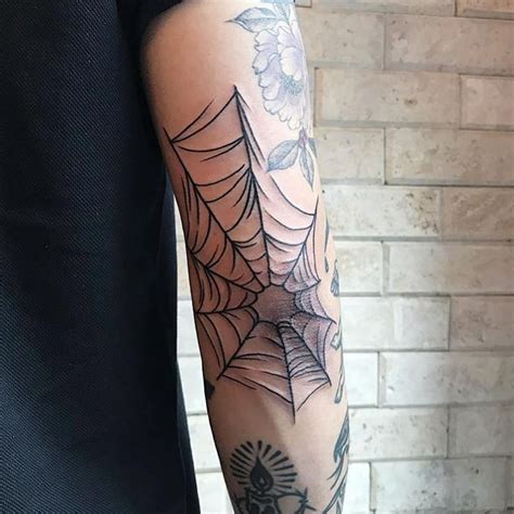 Cobweb Elbow Tattoo Meaning