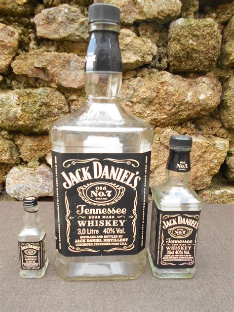 Collectible Jack Daniel's bottles on a shelf