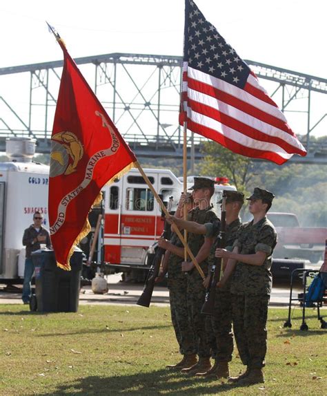 Color guard raising the flag