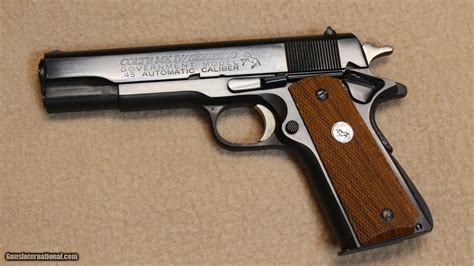 A Colt 1911 pistol with its slide removed