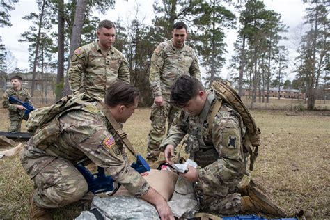 Combat medic providing medical care in a combat zone