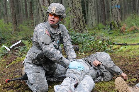 Combat medics treating wounded soldier