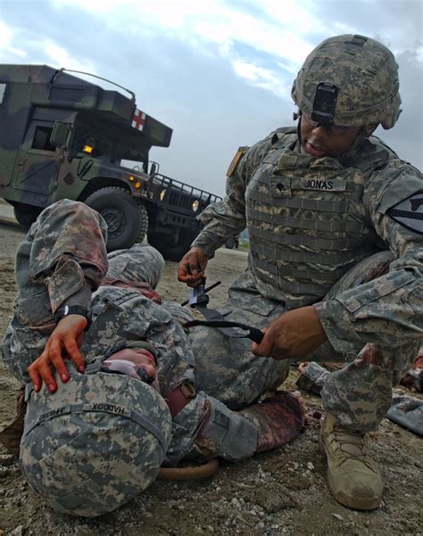 Combat medics maintaining medical equipment