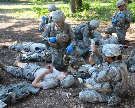 Combat medics assessing patients on the battlefield