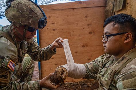 Combat medics providing emergency care to patients