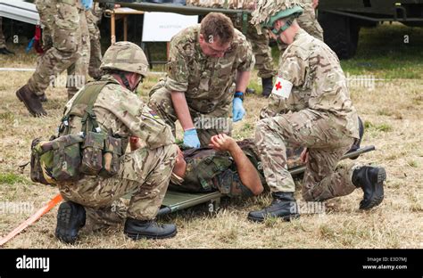 Combat medics treating wounded soldiers