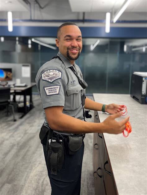 A community service officer assisting a member of the public