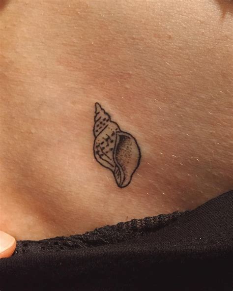 Conch shell tattoo