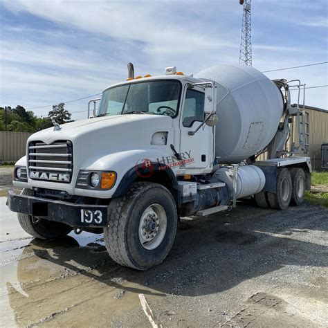 A large concrete mixer truck, weighing around 10 tons