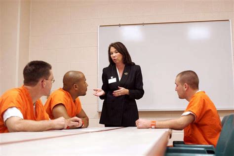 A Correctional Officer providing counseling to an inmate