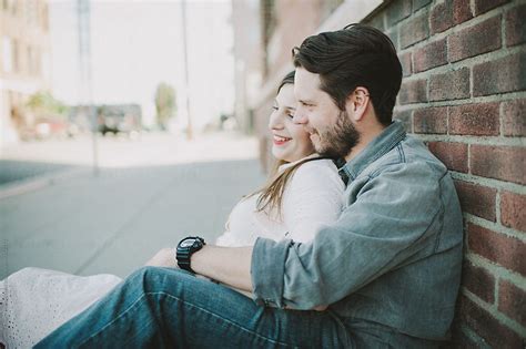 A couple hugging with a heart above them