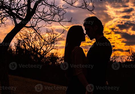 Couple holding hands with a heart above them