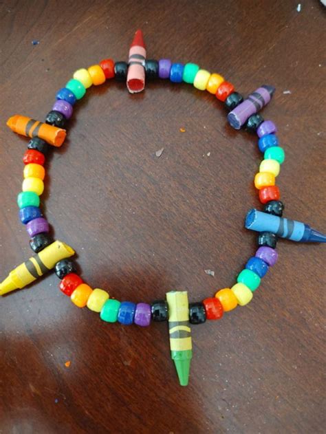 A crayon jewelry art piece